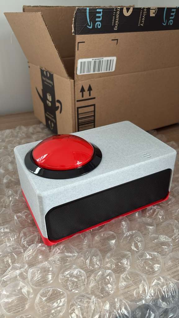 Community-built Button Box with a red arcade button and black speaker grille